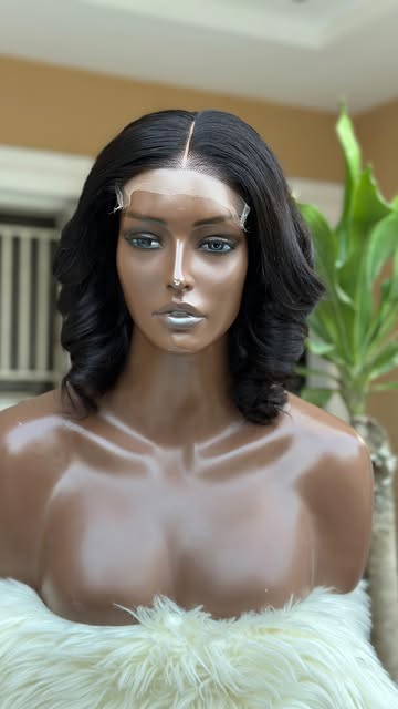 Wavy layered bob unit on a mannequin